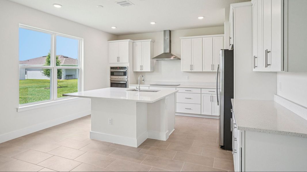Plumeria Floor Plan featuring a bright kitchen with large island by DRB Homes in Trailside located in Mount Dora, FL Plumeria Floor Plan featuring a bright kitchen with large island by DRB Homes in Trailside located in Mount Dora, FL