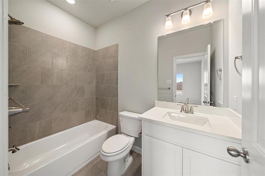 Full bath featuring shower combination and vanity Full bath featuring shower combination and vanity