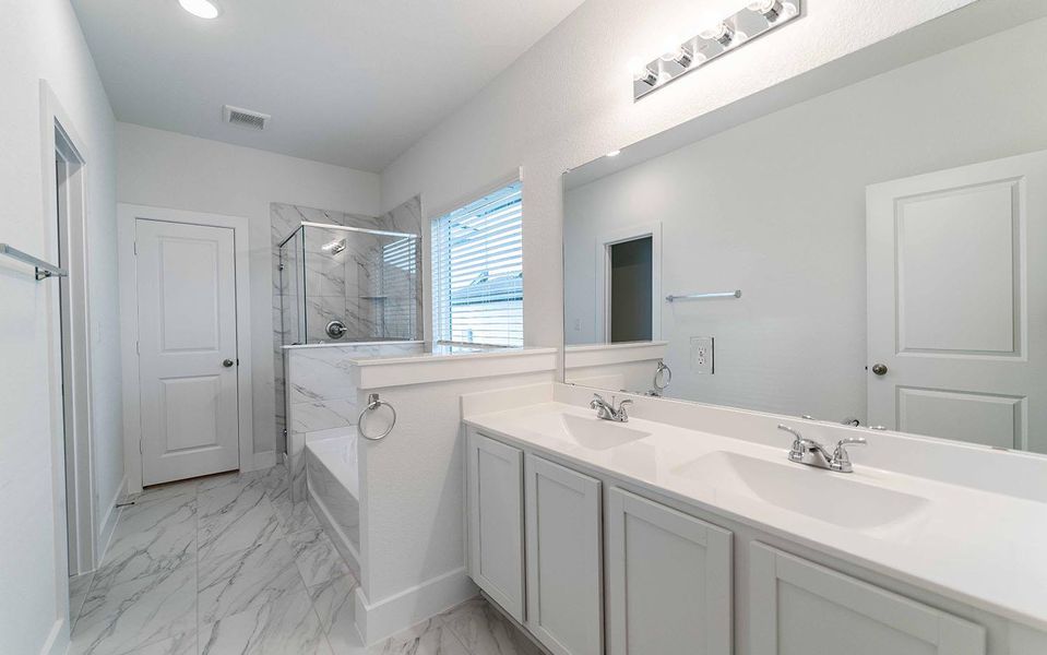 Bathroom featuring double vanity, a marble finish shower, a bath, and light marble finish flooring Bathroom featuring double vanity, a marble finish shower, a bath, and light marble finish flooring