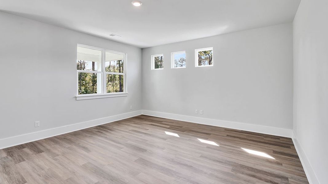 Representative unfurnished interior of a home built from the BRADFORD by D.R. Horton in Indigo Preserve, Leland (Image 26).