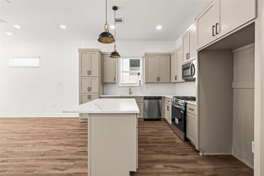 Thoughtful details around every corner. Massive floor-to-ceiling pantry storage ensures your culinary workspace stays entirely clutter-free.