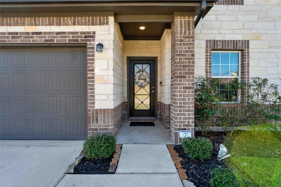 The inviting front porch and upgraded front door set the tone for the quality and care found throughout this home. The inviting front porch and upgraded front door set the tone for the quality and care found throughout this home.