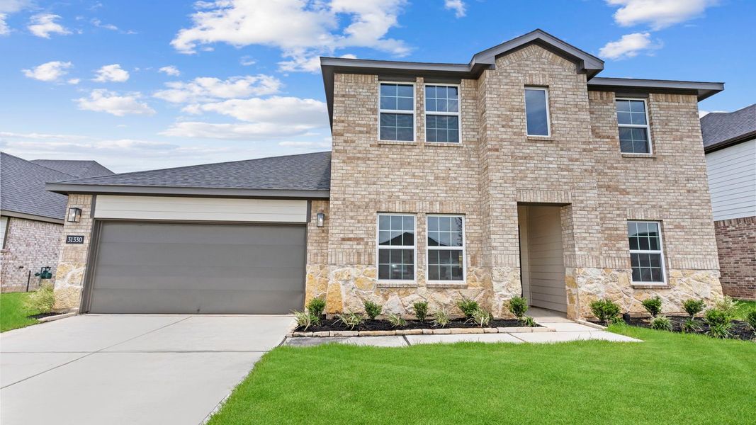 Front exterior of a new home in Tamarron, Fulshear, TX, highlighting curb appeal (Image 27).