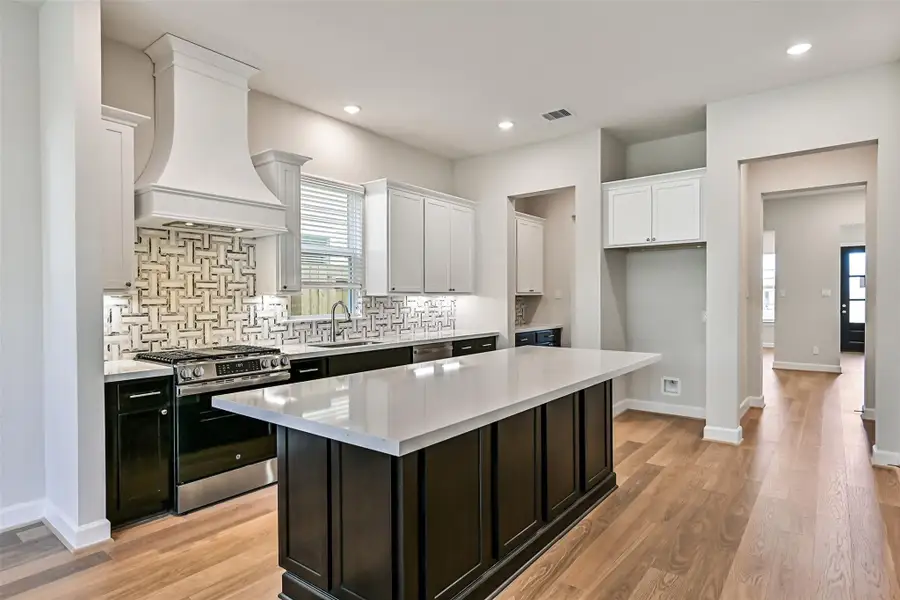 Furnished interior view inside a new home in Pearland Old Townsite, Pearland (Image 14).