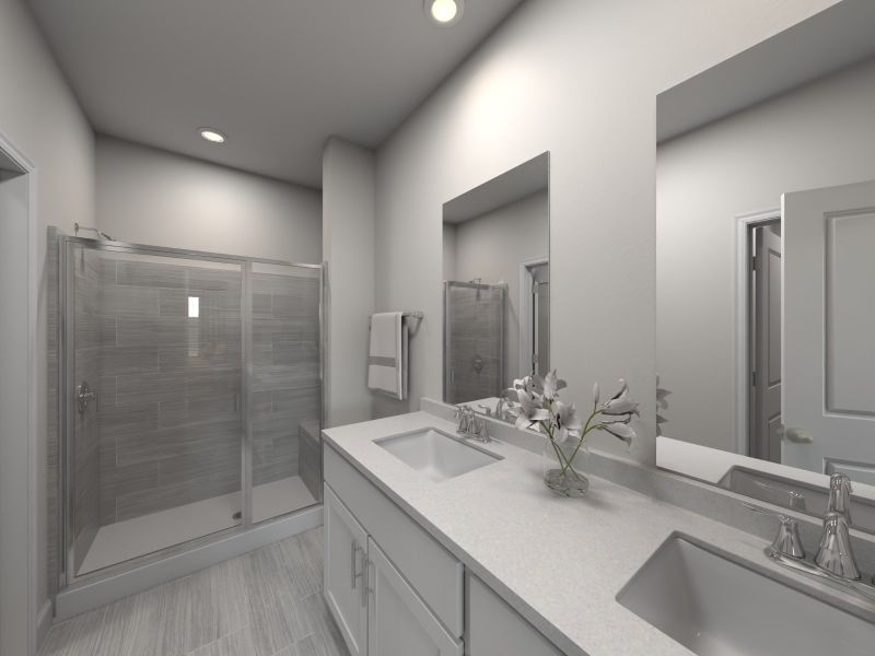The primary bathroom boasts a dual-sink vanity and spacious walk-in shower.