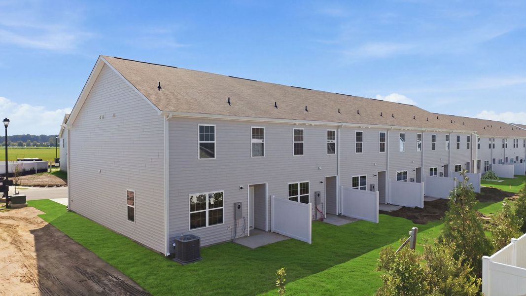 Exterior details and patio area of a home in The Townes at Ridgewood Farms, Winterville (Image 23).