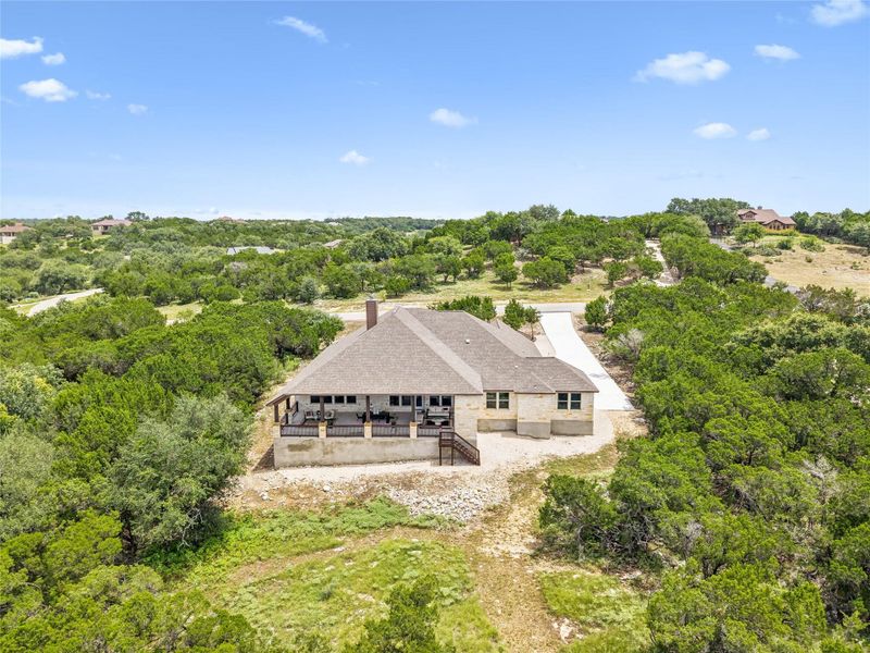 Perched on a verdant hillside, this residence offers a private escape with its expansive views and secluded surroundings.