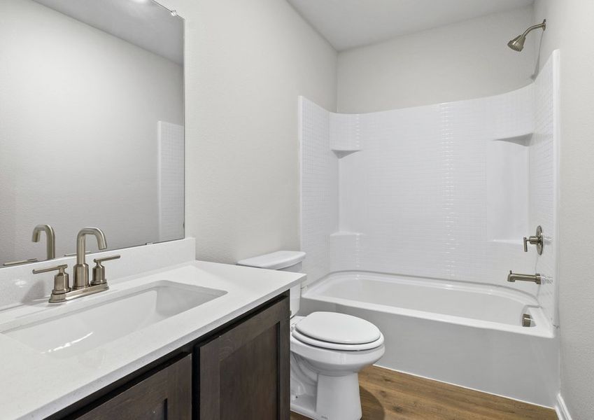 The secondary bathroom has a great vanity space and a shower-tub combo. The secondary bathroom has a great vanity space and a shower-tub combo.