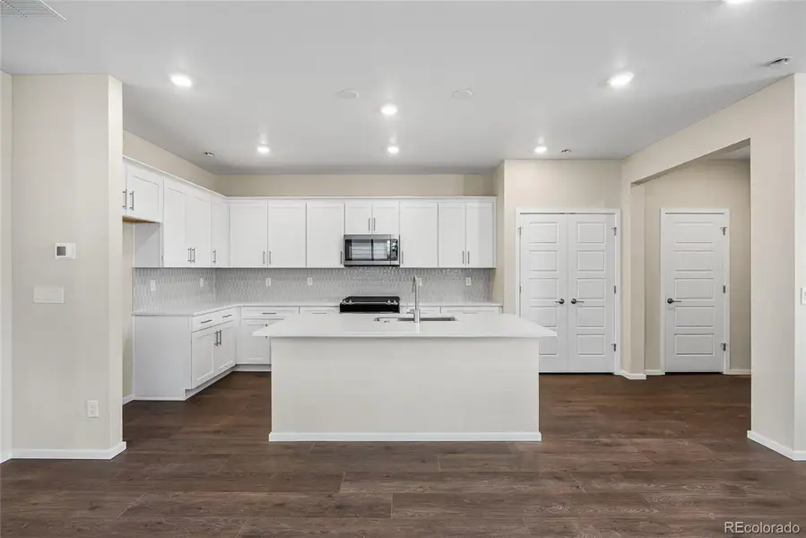 Furnished interior view inside a new home in Barefoot Village, Firestone (Image 11).