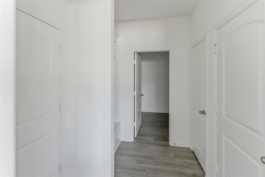 Hallway featuring light wood-style flooring