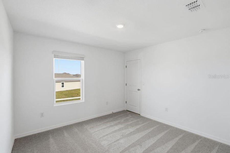 Spacious, unfurnished interior of a new home in Waterstone, Groveland (Image 22).