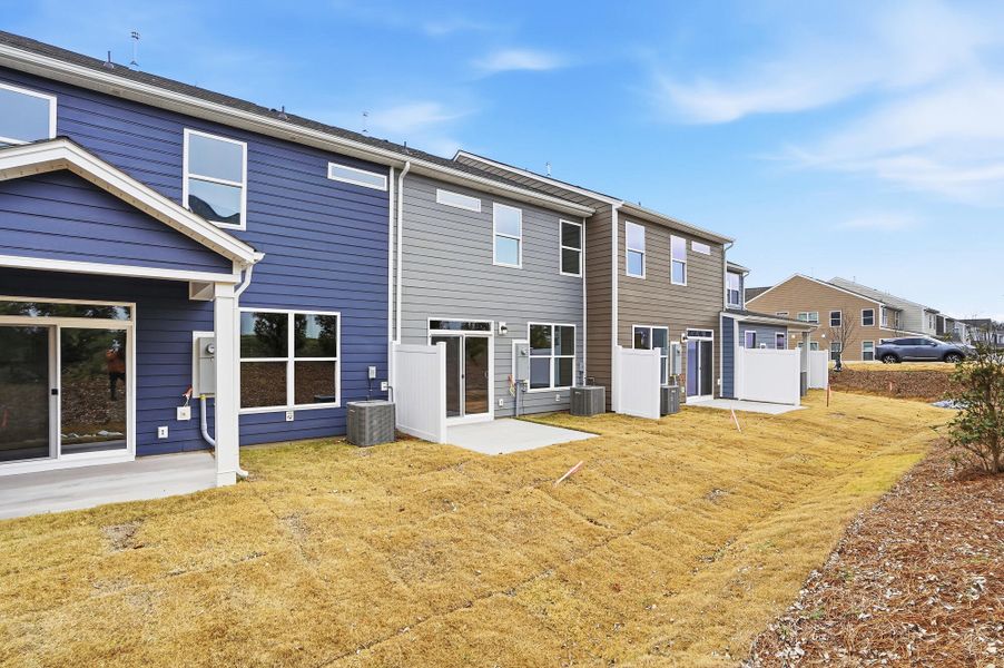 Exterior details and patio area of a home in Harrisburg Village Townhomes, Harrisburg (Image 29).