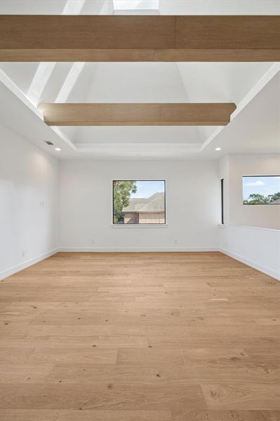 Light pours in from the skylights above the vaulted loft ceiling.  Imagine creating an open home office space here or your private yoga studio or fitness space.