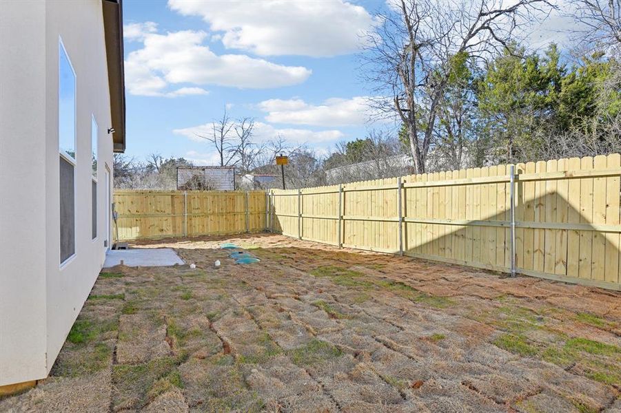 View of yard with a fenced backyard