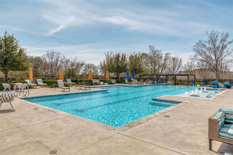 Community pool featuring a patio area
