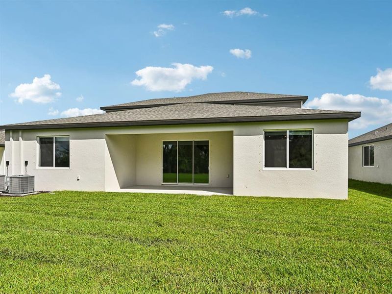 Exterior details and patio area of a home in Oakfield Trails - Signature Series, Parrish (Image 23).