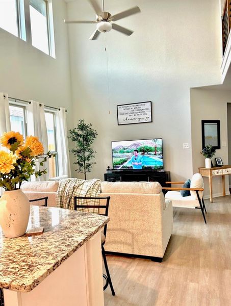 Spacious living area featuring soaring high ceilings and an open feel. Spacious living area featuring soaring high ceilings and an open feel.