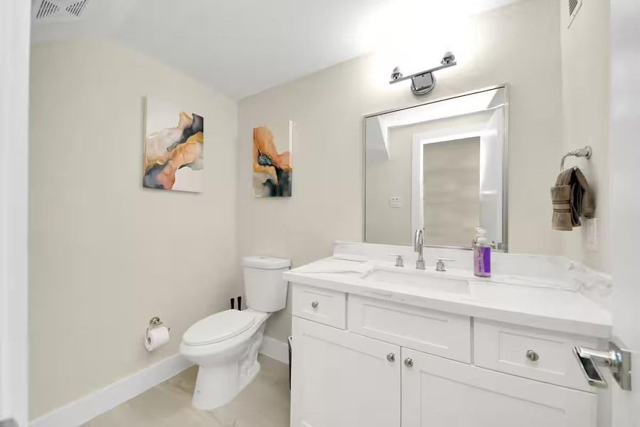 A conveniently located first-floor powder bath gives guests their own space without bringing traffic into the upstairs bedroom areas.