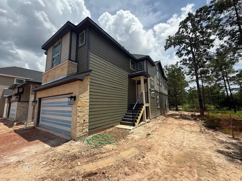 Front exterior of a new home in Kresston, Montgomery, TX, highlighting curb appeal (Image 10). Front exterior of a new home in Kresston, Montgomery, TX, highlighting curb appeal (Image 10).