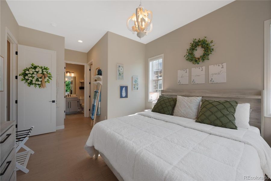 Main Floor Bedroom with Natural Light and Attached Bathroom