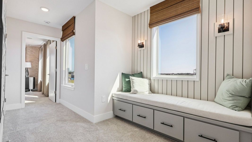 The Mangrove Upstairs Landing with a Cozy Seating Area at Lakeside at Satilla by DRB Homes in Saint Cloud, FL