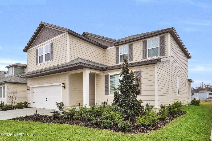 Front exterior of a new home in Jennings Farm, Middleburg, FL, highlighting curb appeal (Image 1).