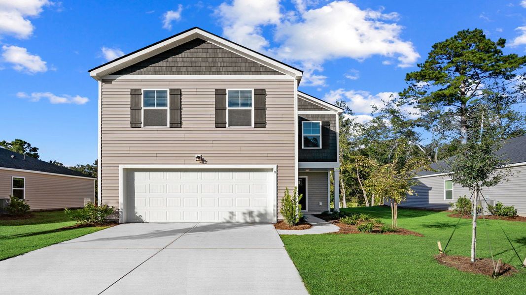 Front exterior of a new home in The Groves at Bees Creek, Ridgeland, SC, highlighting curb appeal (Image 1).