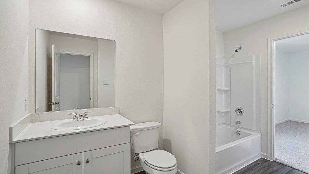 Representative furnished interior of a home built from the Pioneer by Starlight Homes in Avalon Ridge, Cut and Shoot (Image 14).
