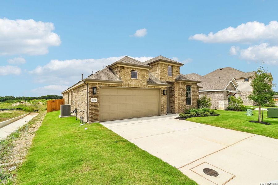 Front exterior of a new home in Stream Waters, Seguin, TX, highlighting curb appeal (Image 19). Front exterior of a new home in Stream Waters, Seguin, TX, highlighting curb appeal (Image 19).