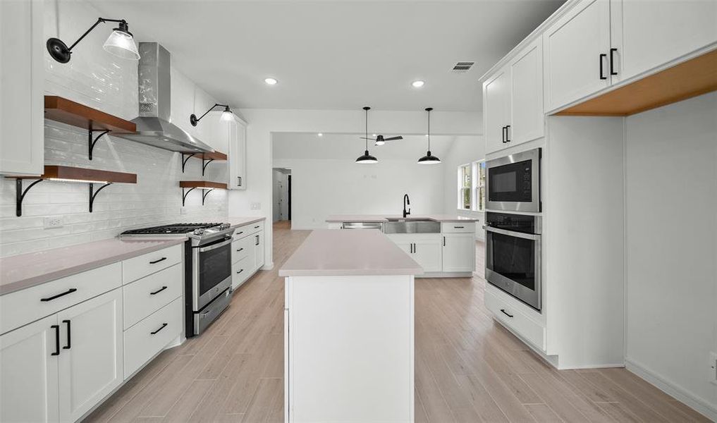 Kitchen with island (*Photo not of actual home and used for illustration purposes only.)