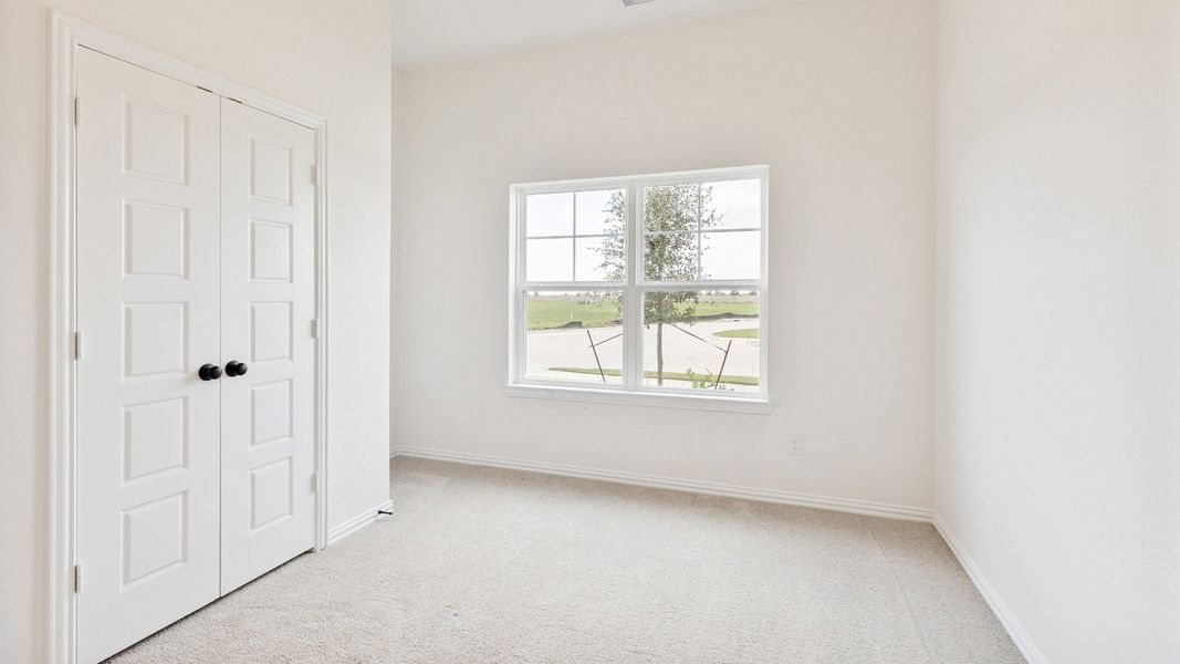 Furnished interior view inside a new home in Creekhaven, Iowa Colony (Image 4).