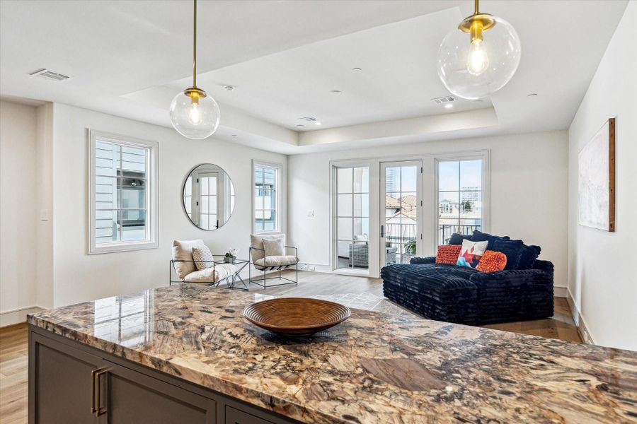 The fourth-floor City Room is this home's secret entertainment retreat. With plenty of room for games, television, or just relaxing, this will become your favorite room. With a large wet bar at one end and covered terrace at the other, this room just waits for your inspiration. The fourth-floor City Room is this home's secret entertainment retreat. With plenty of room for games, television, or just relaxing, this will become your favorite room. With a large wet bar at one end and covered terrace at the other, this room just waits for your inspiration.