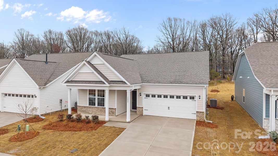 Front exterior of a new home in Cottages at Wingate, Wingate, NC, highlighting curb appeal (Image 18).