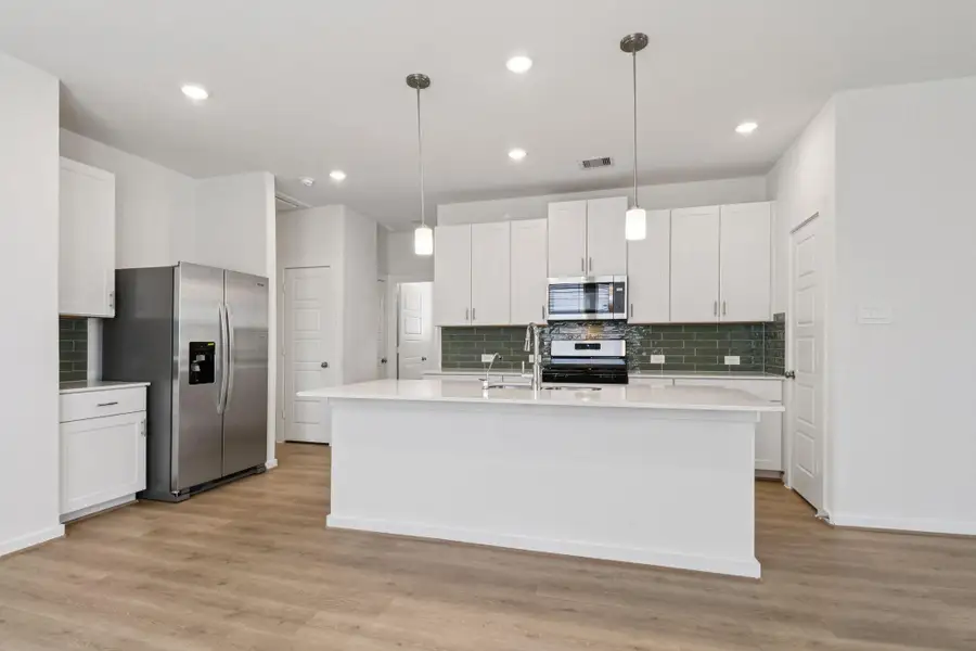 Furnished interior view inside a new home in Pine Lake Cove - Traditional Series, Montgomery (Image 6).