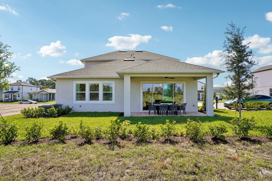 Exterior details and patio area of a home in Northlake at Ovation, Winter Garden (Image 25).
