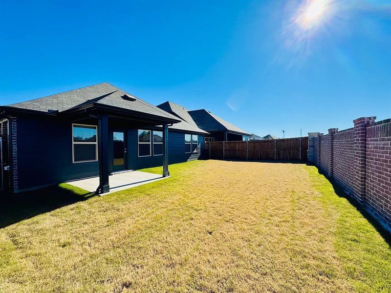 Exterior details and patio area of a home in Trails of Lavon - Signature Series, Lavon (Image 3).