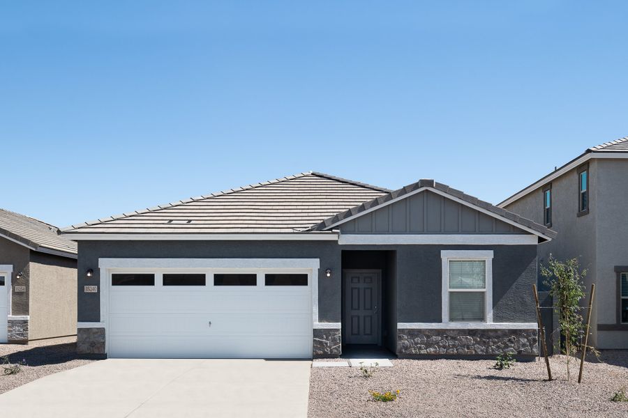 Representative exterior photo of a completed home built from the Prism by Starlight Homes in Agave Trails, Buckeye, AZ (Image 1).