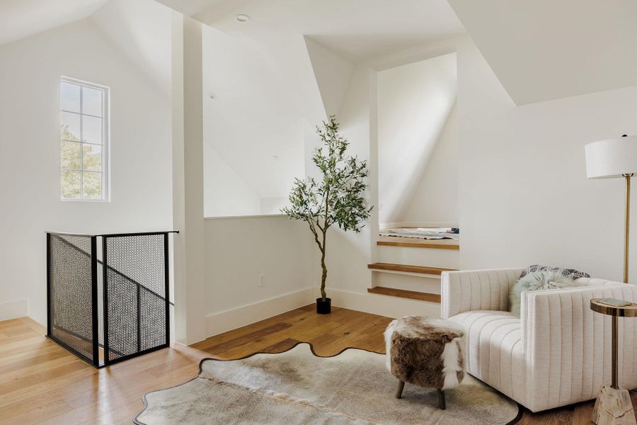 Bathed in light, the upper-level landing showcases ceiling height, subtle texture, and a restful palette of materials. Bathed in light, the upper-level landing showcases ceiling height, subtle texture, and a restful palette of materials.