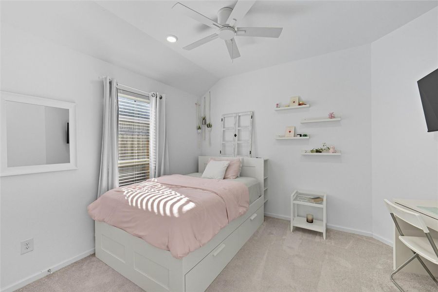 This secondary bedroom features a ceiling fan, and ample natural light from the window, creating a bright and inviting space. This secondary bedroom features a ceiling fan, and ample natural light from the window, creating a bright and inviting space.