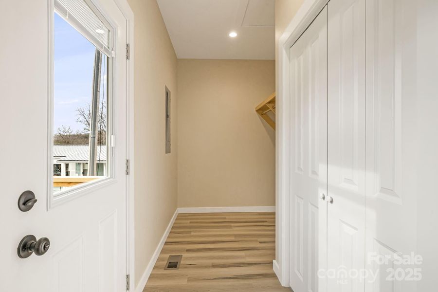Looking to back door and laundry room from kitchen