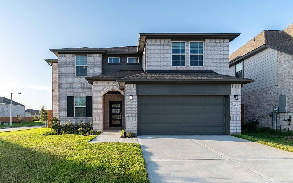 Front exterior of a new home in Lago Mar, Texas City, TX, highlighting curb appeal (Image 1). Front exterior of a new home in Lago Mar, Texas City, TX, highlighting curb appeal (Image 1).