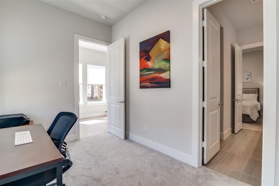 This study view shows the entrance in the back ground.  On the right side of this view is the Jack and Jill bath which has a tub with shower.