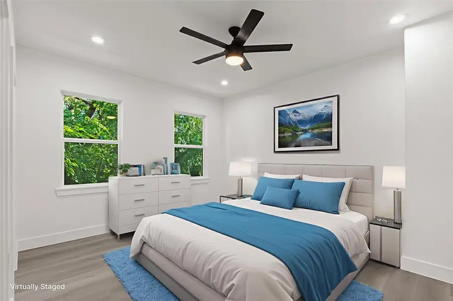 Bedroom with wood finished floors, recessed lighting, and ceiling fan