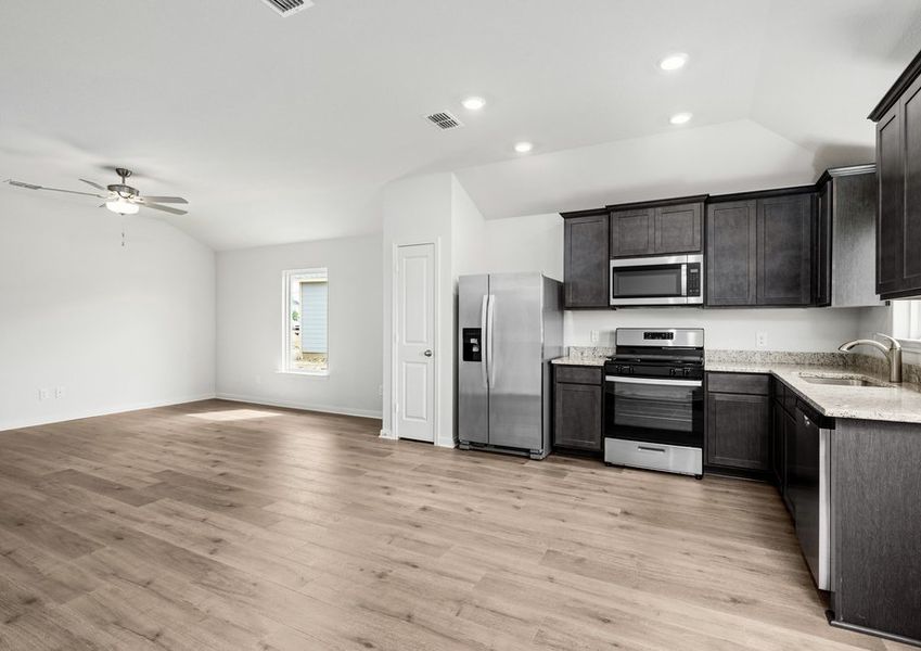 The family room sits right off of the kitchen, so you are always a part of the fun.