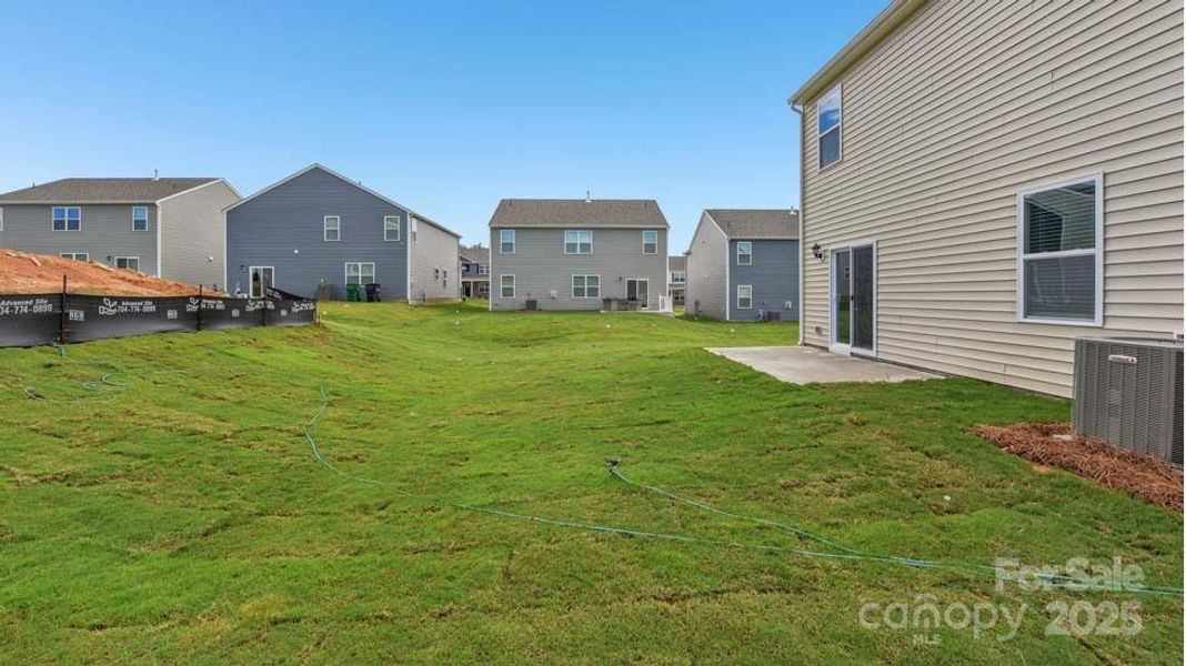 Exterior details and patio area of a home in Cardinal Creek, Charlotte (Image 16).
