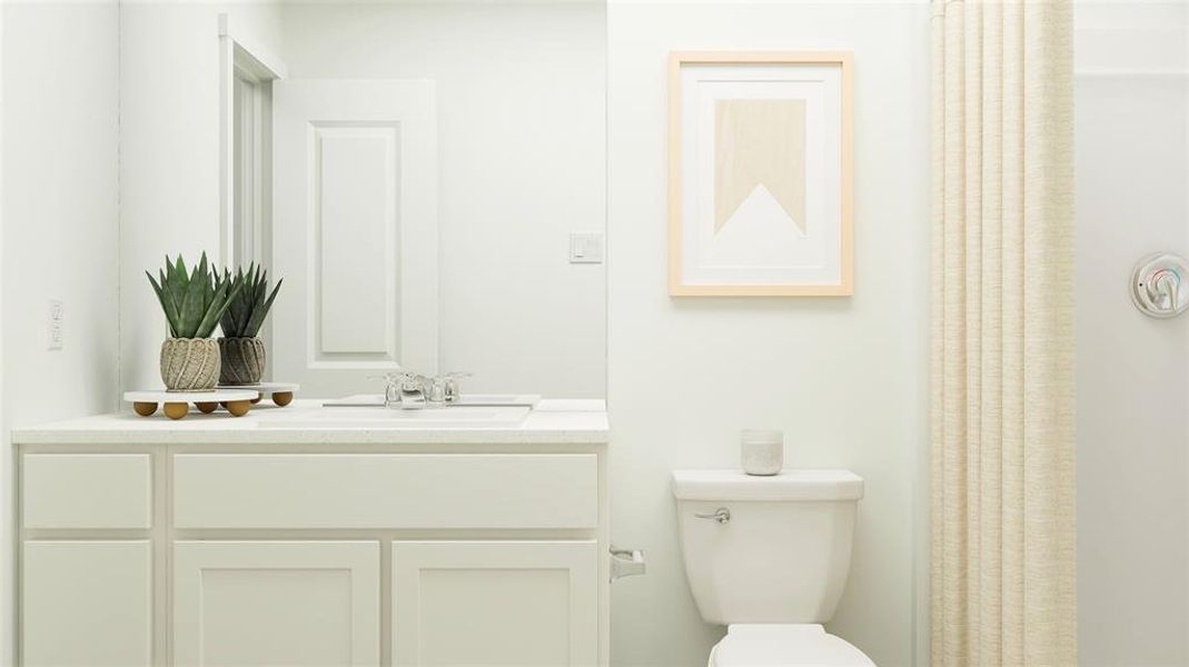 Bathroom with vanity and toilet