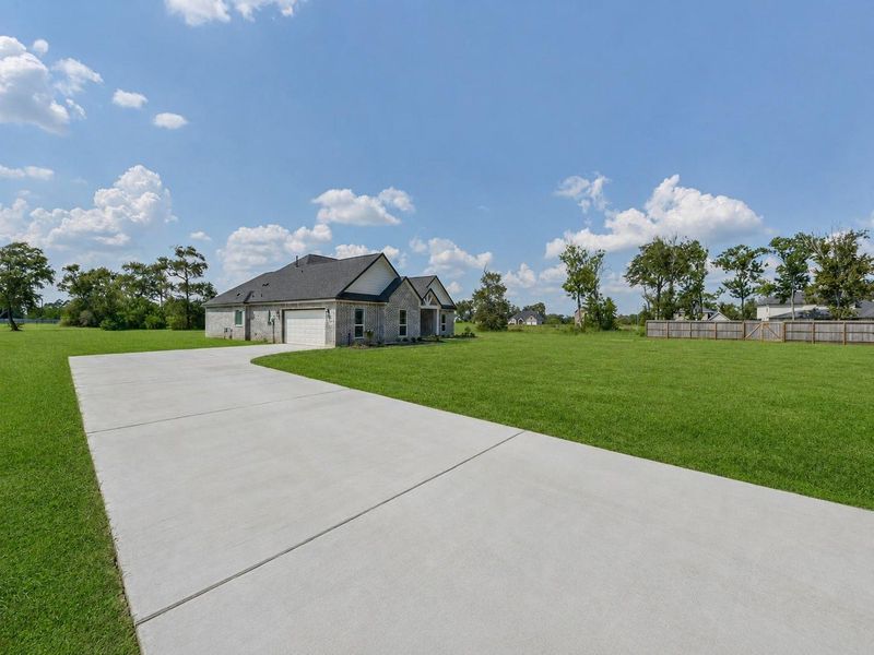 Front exterior of a new home in , Baytown, TX, highlighting curb appeal (Image 22).
