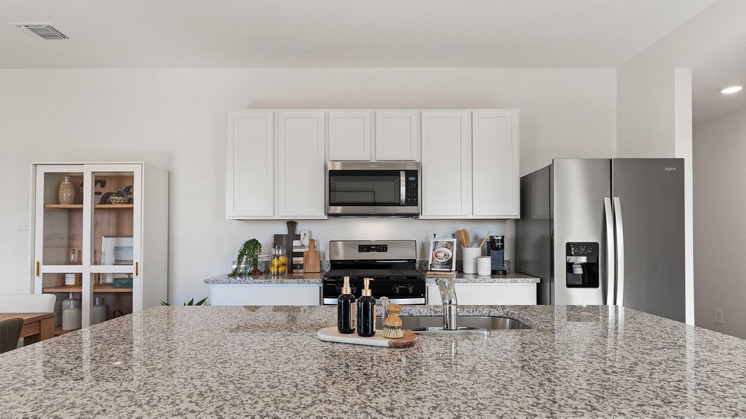 Furnished interior view inside a new home in Watermill, Kyle (Image 5).