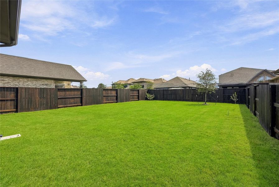 The spacious, fully fenced backyard offers added privacy and plenty of room to create your ideal outdoor setting. The spacious, fully fenced backyard offers added privacy and plenty of room to create your ideal outdoor setting.