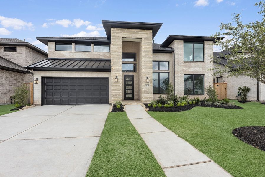 Front exterior of a new home in Candela, Richmond, TX, highlighting curb appeal (Image 2). Front exterior of a new home in Candela, Richmond, TX, highlighting curb appeal (Image 2).